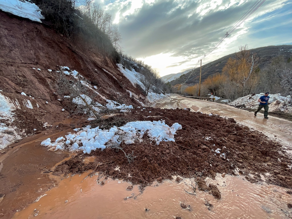 (Trent Nelson  |  The Salt Lake Tribune) A mudslide blocks a lane of traffic in Emigration Canyon on Wednesday, April 12, 2023. This week, officials are again keeping a close eye on Emigration Creek, which is expected to exceed flood stage late Tuesday and Wednesday.