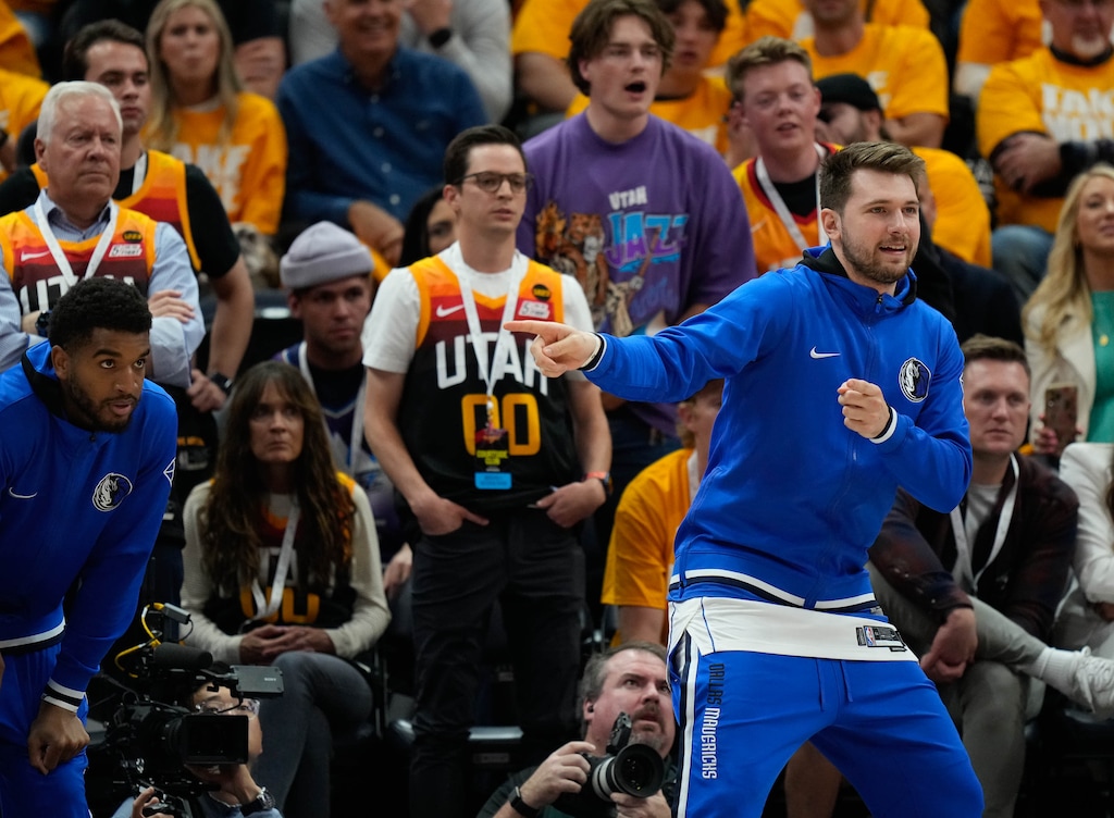 (Francisco Kjolseth | The Salt Lake Tribune) Dallas Mavericks guard Luka Doncic, right, reacts to the game against the Utah Jazz in Game 3 of an NBA basketball first-round playoff series, Thursday, April 21, 2022, in Salt Lake City. Doncic did not play in the game as he is recovering from a left calf strain.