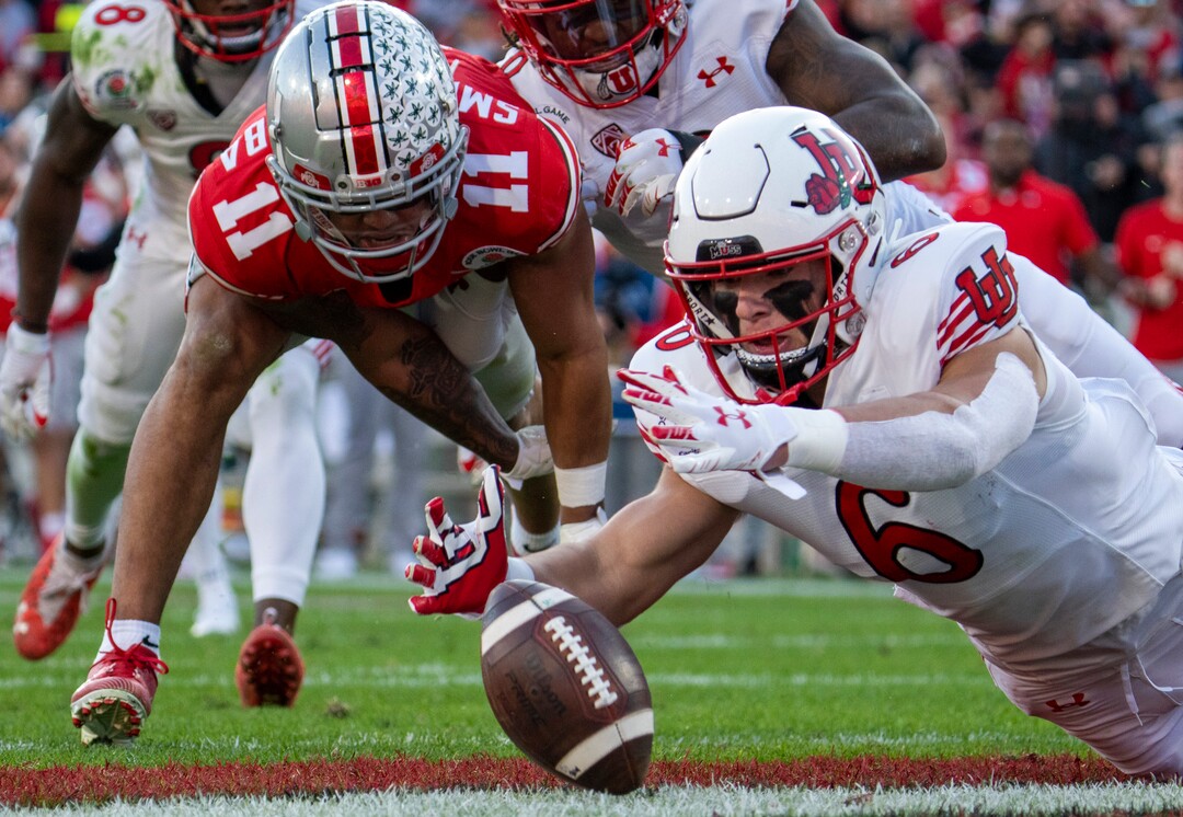 (Rick Egan | The Salt Lake Tribune)  Ohio State Buckeyes wide receiver Jaxon Smith-Njigba (11) tries to recover his fumble as Utah Utes running back Ricky Parks (6) dives for the ball to get possession for Utah, in football action between Utah Utes and Ohio State Buckeyes in the Rose Bowl in Pasadena, CA, on Saturday, January 1, 2022.