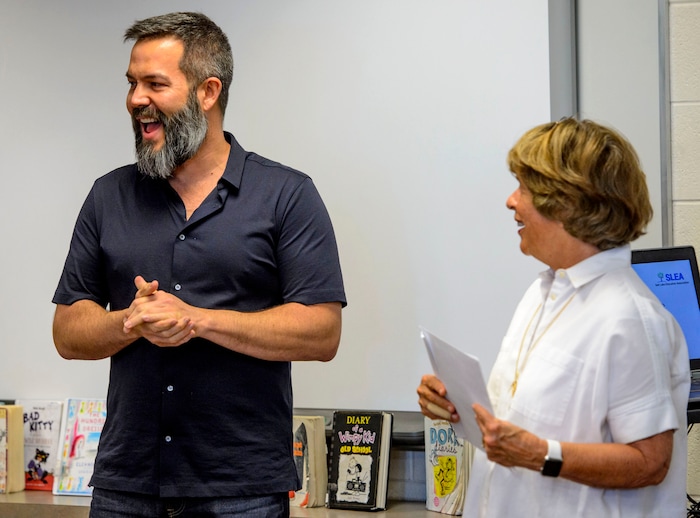 (Steve Griffin  |  The Salt Lake Tribune)  Franklin Elementary School special education teacher Jason Adam Tackett is surprised by Karen Huntsman, as she made the announcement  that he has won the Huntsman Award for Excellence in Education, during the school's faculty meeting in Salt Lake City Monday April 23, 2018. With the award comes a $10,000 cash prize.