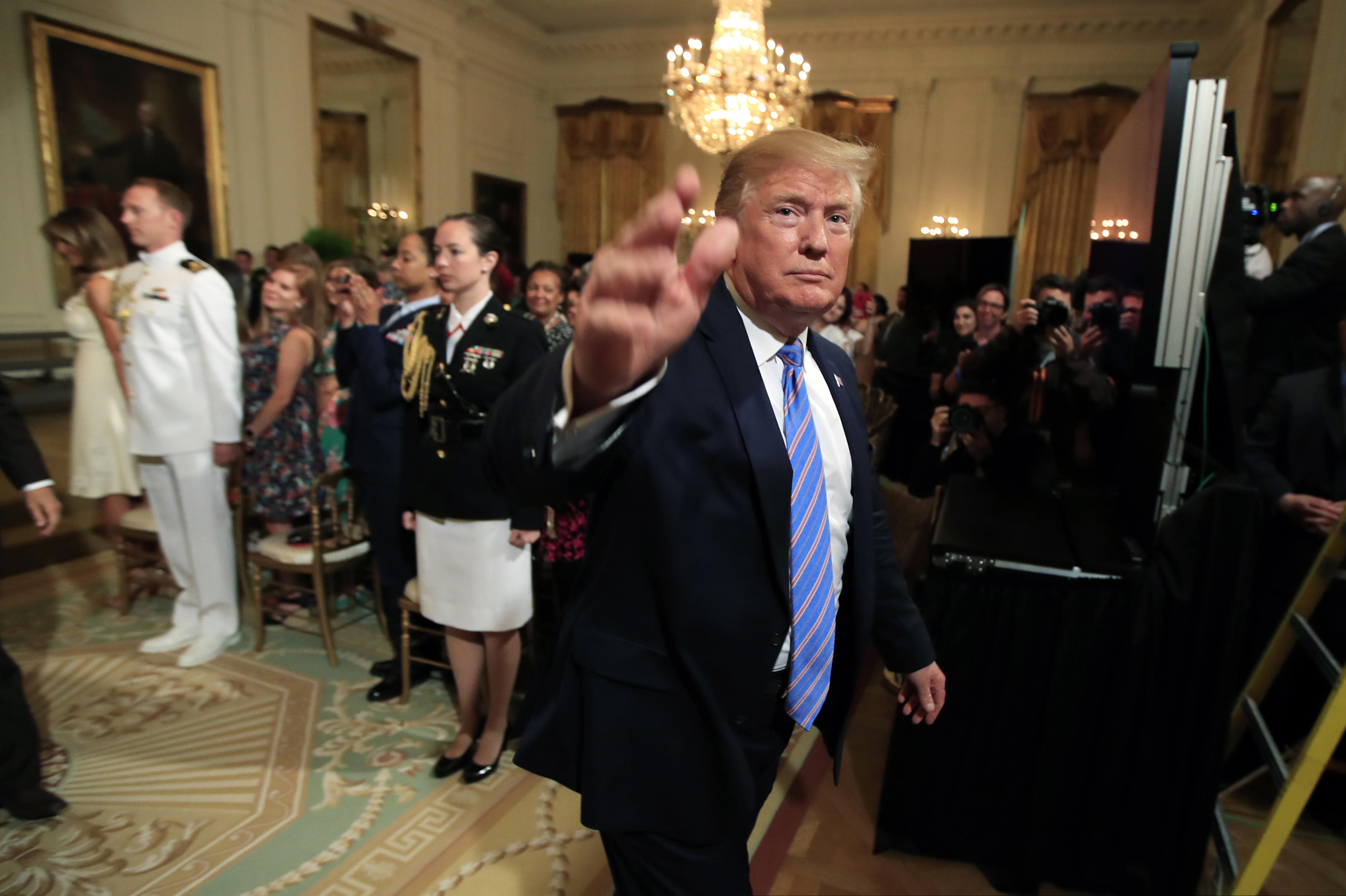 (Manuel Balce Ceneta | The Associated Press)  President Donald Trump waves as he leaves the East Room during a celebration of military mothers with first lady Melania Trump at the White House in Washington, on Friday, May 10, 2019.