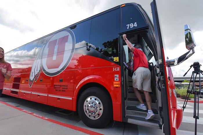 (Francisco Kjolseth  |  The Salt Lake Tribune)  University of Utah athletic director Chris Hill says goodbye to friends and staff at the Huntsman Center on Friday, June 1, 2018, as he climbs aboard a red Ute-branded Holiday Motor coach bus to the sounds of cheers and applause after 31 years on the job.
