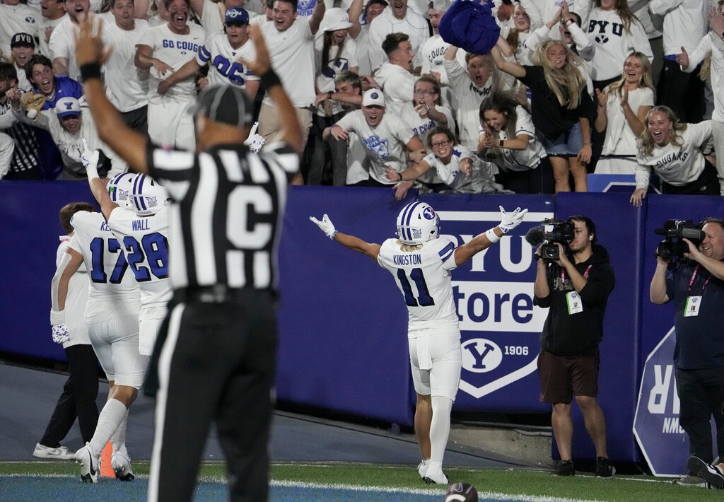 (Bethany Baker  |  The Salt Lake Tribune) Brigham Young Cougars wide receiver Parker Kingston (11) celebrates his punt return touchdown during the game between the Brigham Young Cougars and the Kansas State Wildcats in Provo on Saturday, Sept. 21, 2024.