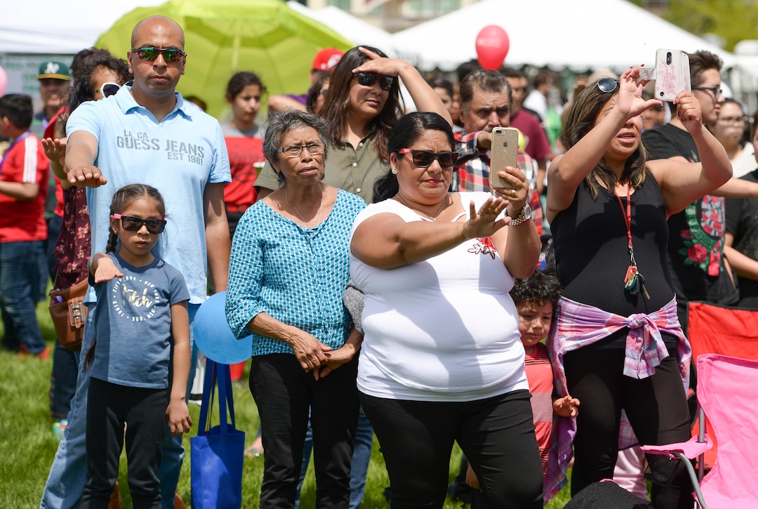(Leah Hogsten  |  The Salt Lake Tribune) The crowd comes to attention during the playing of the Mexican National Anthem at the Cinco de Mayo Celebration, Saturday, May 5, 2018 at Centennial Park in West Valley City.