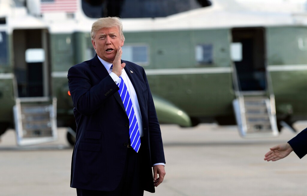 (Susan Walsh | The Associated Press) In this Sept. 26, 2017, file photo, President Donald Trump responds to a reporter's question on health care after arriving at John F. Kennedy International Airport in New York. Trump says insurers are “going wild” about his new health care options and “millions and millions” of people will be signing up. But insurance companies say it will take time to design new plans and get approval from state regulators, and two major industry groups have actually expressed concern about potential downsides for consumers.