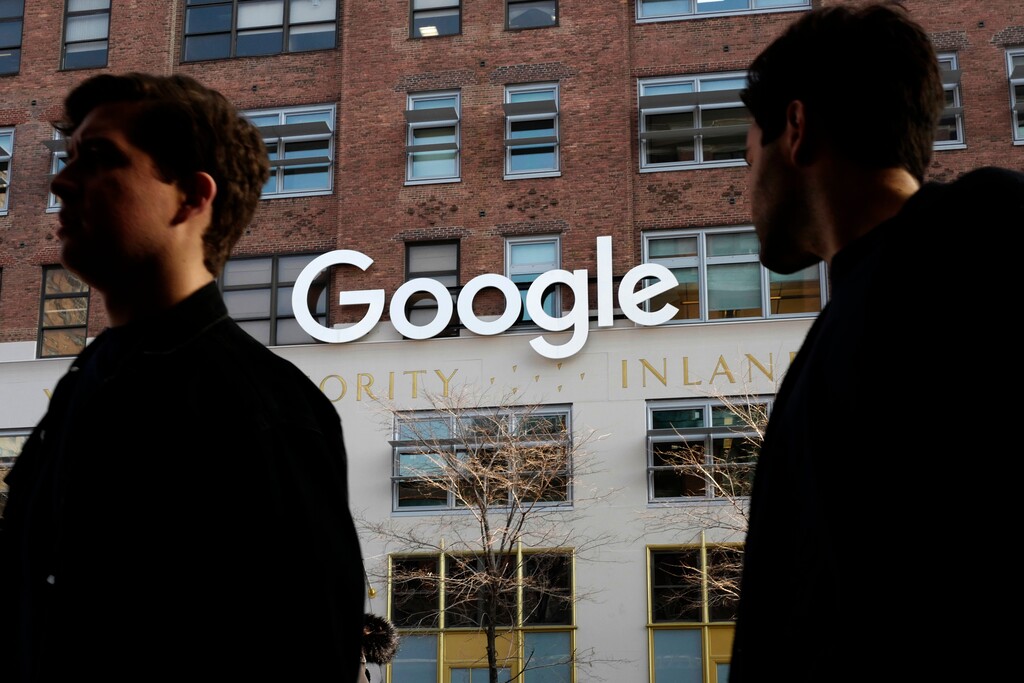 In this Dec. 4, 2017, photo, people walk by Google offices in New York. Google is blaming "vandalism" at Wikipedia for search results that incorrectly said the ideology of the California Republican Party included "Nazism." The results appeared in a Google information box screen-captured by Vice Media on Thursday, May 31, 2018. Google quickly removed the section on ideology. (AP Photo/Mark Lennihan)