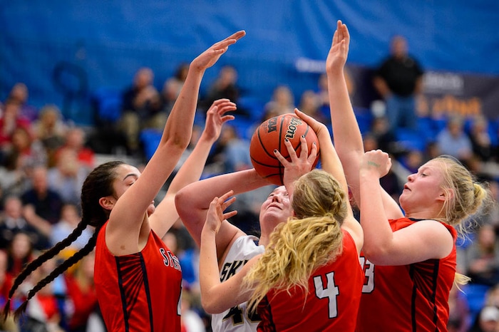 (Trent Nelson | The Salt Lake Tribune)  Springville's Kallysta Strong (11), Springville's Brooke lynn Galbraith (4), and Springville's Addisyn Johnson (33) defend Skyline's Cameron Mooney (40) as Skyline faces Springville in the 5A High School Girls' Basketball Tournament at SLCC in Taylorsville, Wednesday Feb. 21, 2018.