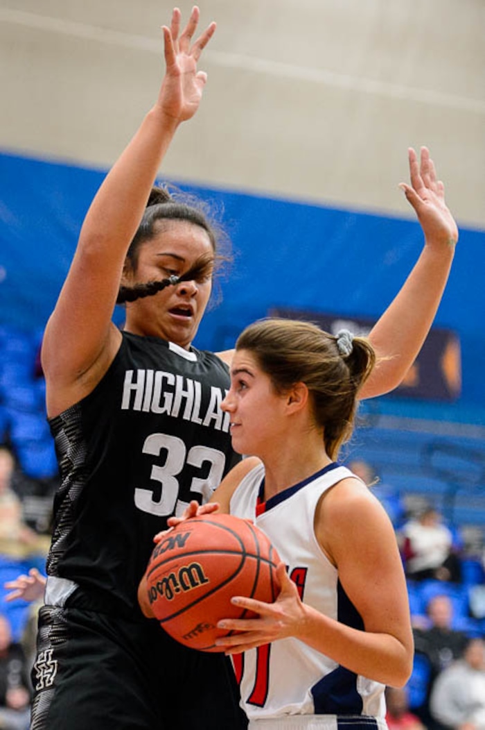 (Trent Nelson | The Salt Lake Tribune)  Woods Cross's Olivia Barton (11) runs into Highland's Lana Olevao (33) as Woods Cross faces Highland in the 5A High School Girls' Basketball Tournament at SLCC in Taylorsville, Wednesday Feb. 21, 2018.