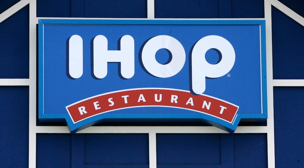 (Nick Ut | The Associated Press) In this July 16, 2007 file photo, an IHOP restaurant sign is shown in Burbank, Calif. The International House of Pancakes has dropped a lawsuit that accused a Kansas City church of trademark infringement and says it will settle the flapjack flap out of court.
