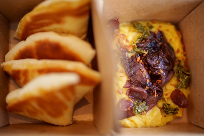 (Trent Nelson  |  The Salt Lake Tribune) Fava
(yellow split purée, roasted cipollini onions, grape leaf salsa verde, crunchy garlic,
pita bread) at Manoli's in Salt Lake City on Saturday, Jan. 8, 2022.