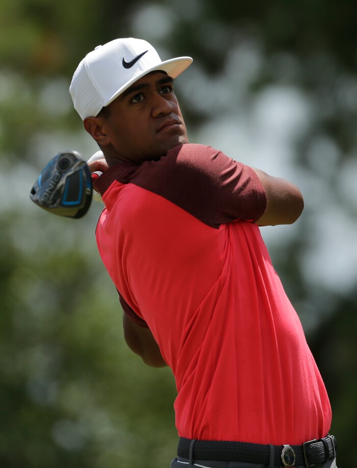 Tony Finau watches his tee shot on the third hole during the third round of the PGA Championship golf tournament at the Quail Hollow Club Saturday, Aug. 12, 2017, in Charlotte, N.C. (AP Photo/Chuck Burton)