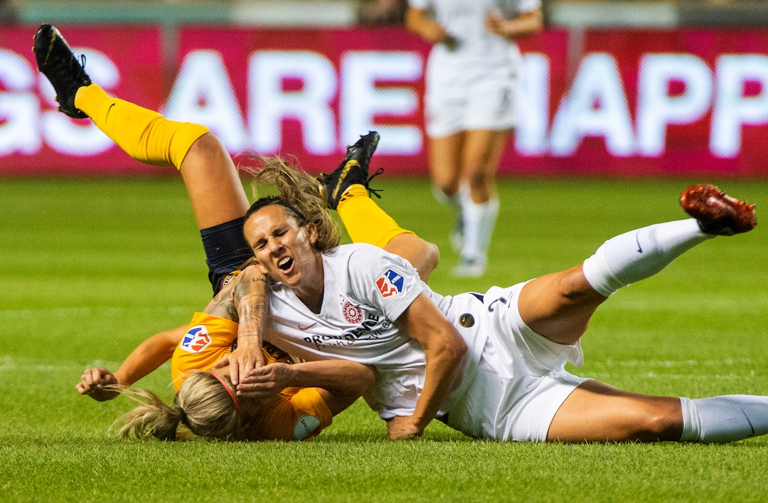 (Rick Egan  |  The Salt Lake Tribune)    Utah Royals FC midfielder Gunnhildur Jónsdóttir (66) collides with Portland Thorns FC defender Katherine Reynolds (2), in Soccer action between Utah Royals FC and Portland Thorns FC, in Sandy, Friday, July 19, 2019.