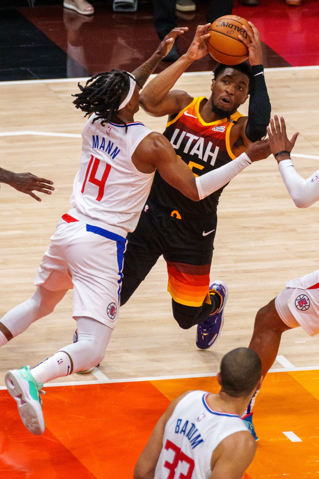 (Trent Nelson  |  The Salt Lake Tribune) Utah Jazz guard Donovan Mitchell (45) runs into LA Clippers guard Terance Mann (14) as the Utah Jazz host the Los Angeles Clippers in a Game 5 matchup, NBA basketball in Salt Lake City on Wednesday, June 16, 2021.