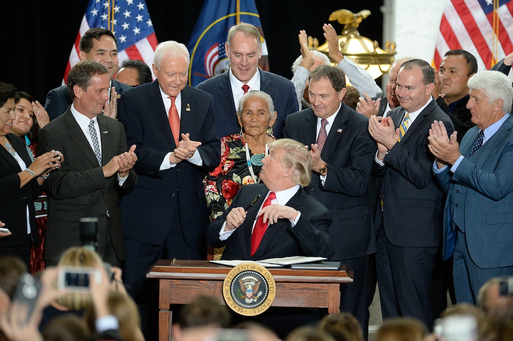 (Francisco Kjolseth  |  The Salt Lake Tribune)  U.S. President Donald Trump surrounded by Utah representatives looks at Sen. Orrin Hatch before giving him the pen used to signs a presidential proclamation to shrink Bears Ears and Grand Staircase-Escalante national monuments at the Utah Capitol on Monday, Dec. 4, 2017.