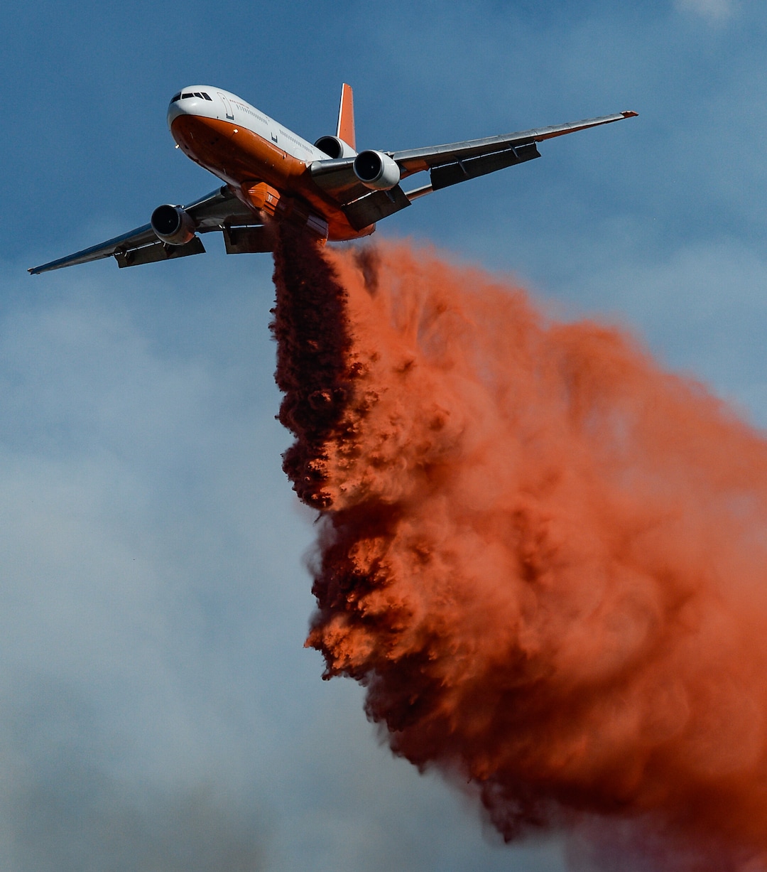 (Francisco Kjolseth  |  The Salt Lake Tribune)  Fire Crews direct a slurry bomber to unload its payload along the East Bountiful bench that grew to 150 acres early Friday morning, Aug. 30, 2019, and destroyed three homes.  On Sept. 2, officials said the fire was 100% contained.