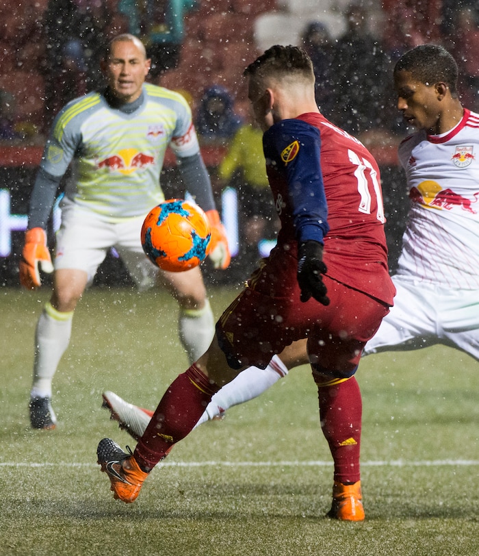 (Rick Egan  |  The Salt Lake Tribune)     Real Salt Lake midfielder Albert Rusnak (11) kicks the ball, as New York Red Bulls goalkeeper Luis Robles (31) defends in MLS action between Real Salt Lake and New York Red Bulls at Rio Tinto Stadium, Saturday, March 17, 2018.


