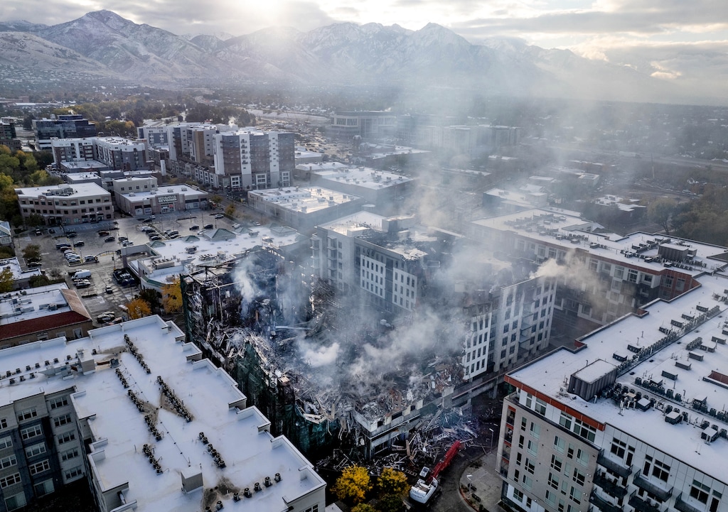 (Francisco Kjolseth | The Salt Lake Tribune) The planned Residences at Sugar Alley continues to smolder and occasionally ignite near 1040 E. 2220 South in Sugar House in Salt Lake City on Thursday Oct. 27, 2022. A newly released report compiled by the Salt Lake City Fire Department and Salt Lake City police narrows the cause of the Oct. 25 fire down to two possible culprits.