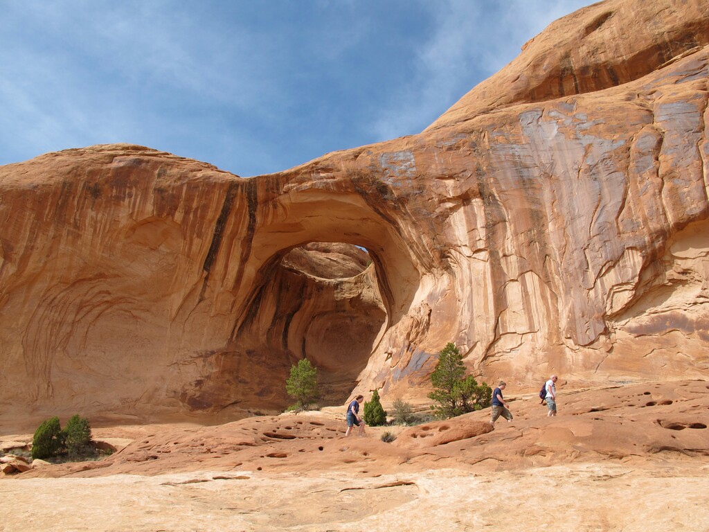 (Nate Carlisle | Tribune file photo) Hikers pass Bowtie Arch, May 5, 2010. The trail starts on Potash Road outside of Moab and includes a view of Corona Arch and Bootleggers Canyon.