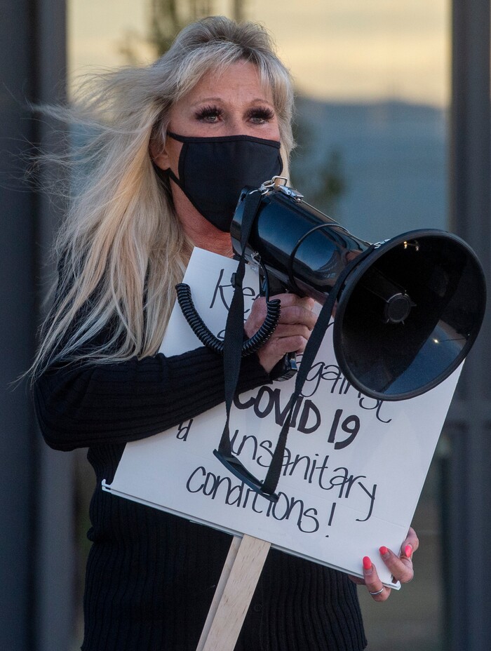 (Rick Egan  |  The Salt Lake Tribune)  A woman named Brenda speaks at a rally for prison inmates, after a COVID-19 outbreak has spread at the Draper prison, at the Department of Corrections, on Tuesday, Oct. 13, 2020.