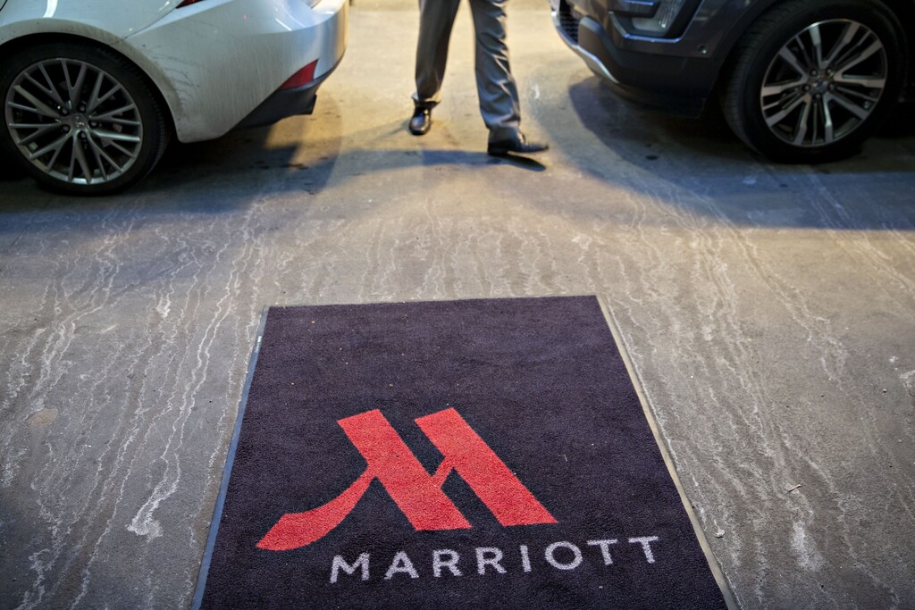 (Daniel Acker | Bloomberg) A logo is displayed on a rug outside a Marriott International Inc. hotel in Chicago on Nov. 30, 2018.