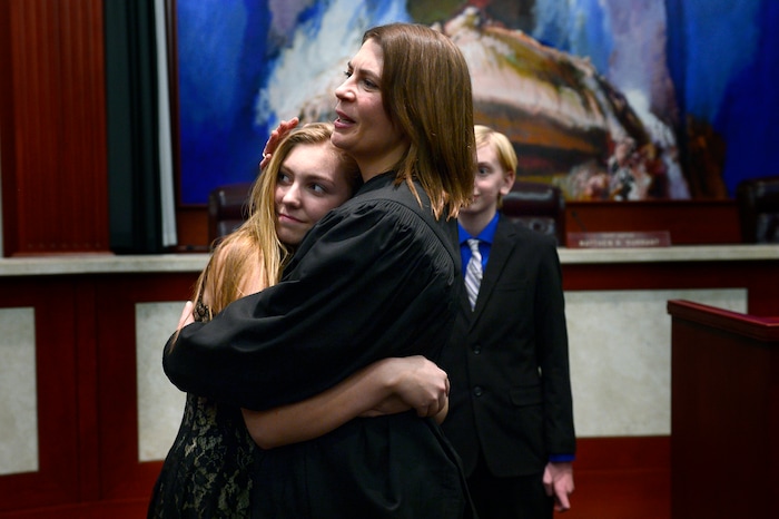 (Scott Sommerdorf   |  The Salt Lake Tribune)   during the Paige Petersen hugs her niece Jaden Olaveson after having been sworn in as the new Utah Supreme Court justice, Friday, January 19, 2018.