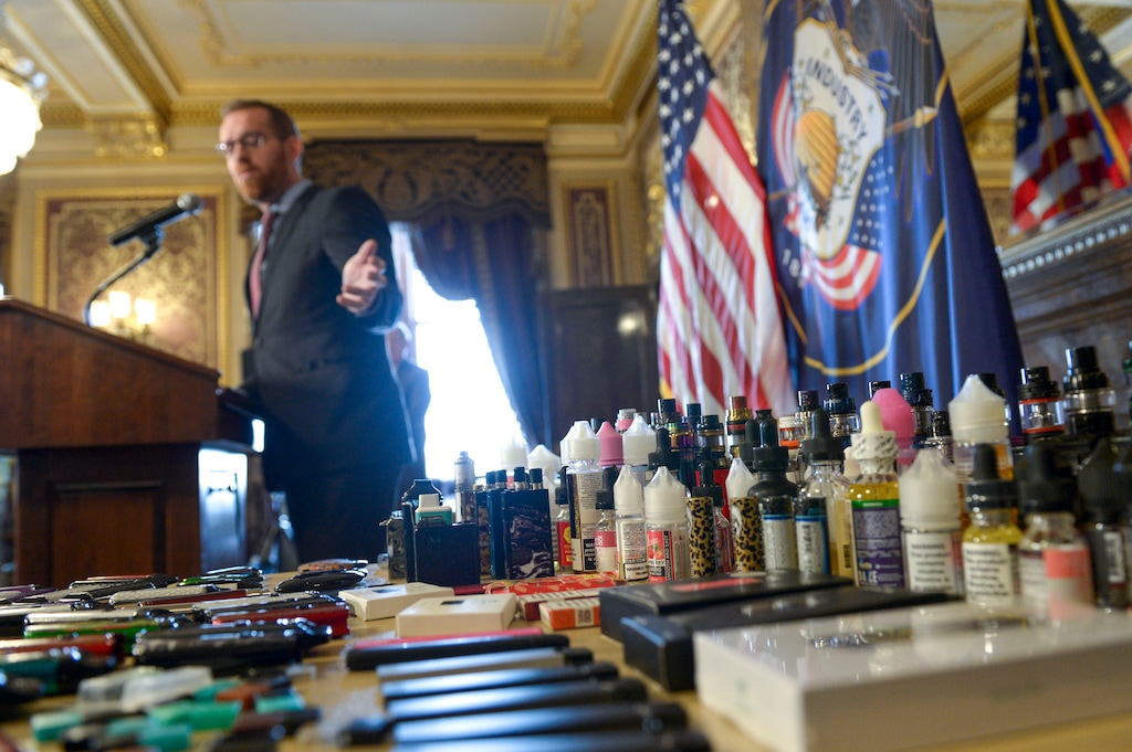 (Leah Hogsten  |   Tribune file photo) Stuart Hudnall, Vice-Principal at Herriman High School talks about the vaping products the school has confiscated from students in this year alone. Legislators, health officials and health advocates held news a conference Jan. 29, 2020 at the Captitol to outline anti-vaping measures they hope to pass during the legislative session.
