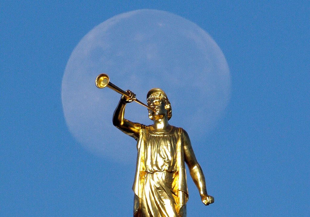 (Rick Bowmer | AP file photo) Angel Moroni statue sits atop the Salt Lake Temple in 2014.