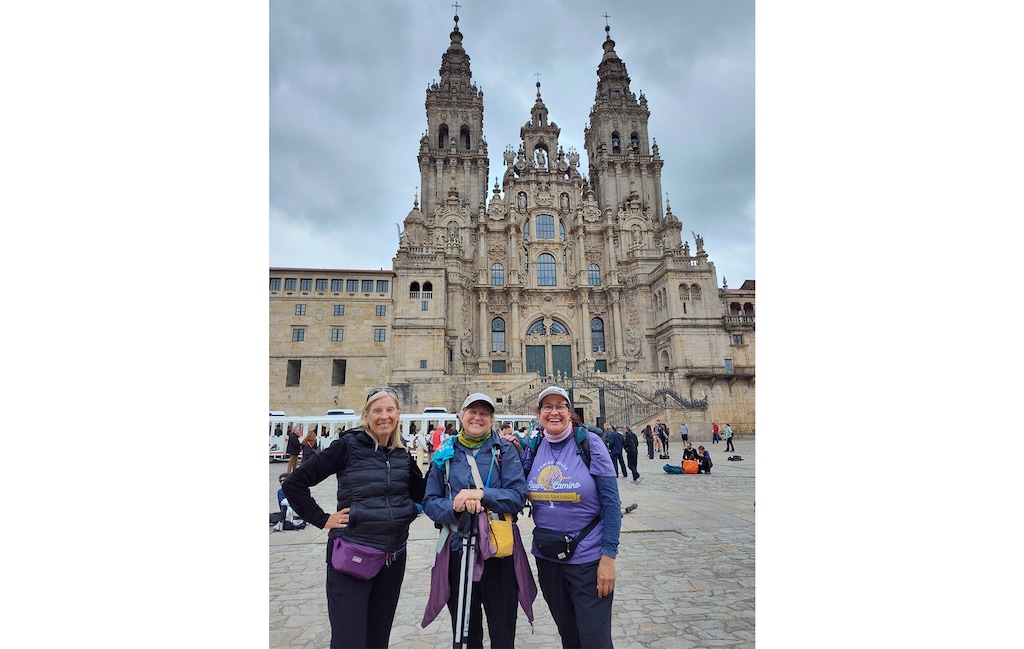 (Joyce DeToni-Hill) From left: Kathy Brown, the Rev. Joyce DeToni-Hill and the Rev. Celeste Lasich celebrate the end of the journey on the Camino Inglés in front of the cathedral in Santiago de Compostela, Spain.