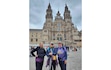 (Joyce DeToni-Hill) From left: Kathy Brown, the Rev. Joyce DeToni-Hill and the Rev. Celeste Lasich celebrate the end of the journey on the Camino Inglés in front of the cathedral in Santiago de Compostela, Spain.