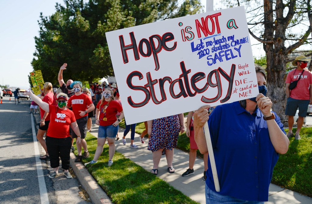 (Francisco Kjolseth | The Salt Lake Tribune) Jennifer Levy who teaches arts at two different schools and sees 1200 students, joins hundreds of Granite School district teachers gathered at the Granite School District office on Tuesday, August 4, 2020, to protest the district’s plans for reopening, which will allow students back into the classroom, like normal, five days a week.