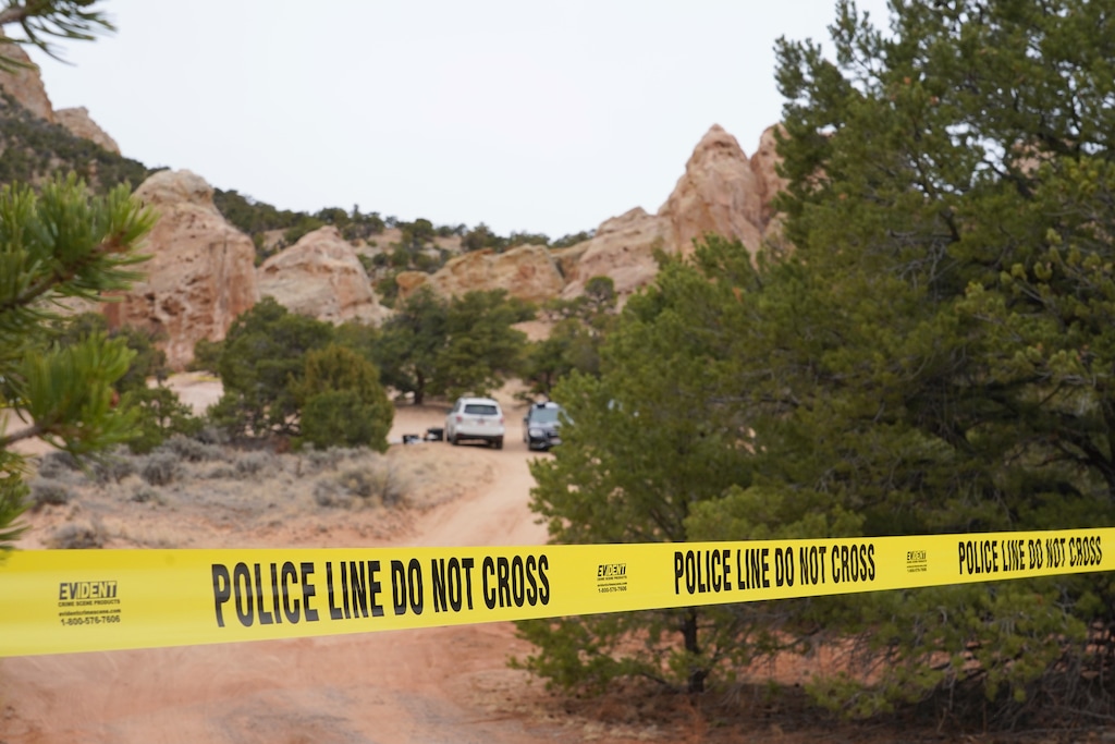 (George Frey | AP) Authorities conduct an investigation Thursday, March 5, 2026, into the deaths of two women a day earlier on a trail just west of Capitol Reef National Park near Teasdale.