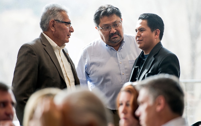 (Leah Hogsten  |  The Salt Lake Tribune)  l-r Navajo Nation's translator Woody Lee and the Navajo Nation's Human Rights Commission Executive Director Leonard Gorman talk with members of the tribe in favor of U.S. District Court Judge Robert Shelby's redistricting proposals prior to Thursday's hearing in Monticello, November 16, 2017. The proposals would redraw voting districts to ensure significant American Indian majorities in two of three County Commission districts and on four of five school board voting districts as the result of a January 2012 lawsuit filed in U.S. District Court by the Navajo Nation. The lawsuit seeks the redrawing of voting districts to reflect the 2010 U.S. Census.