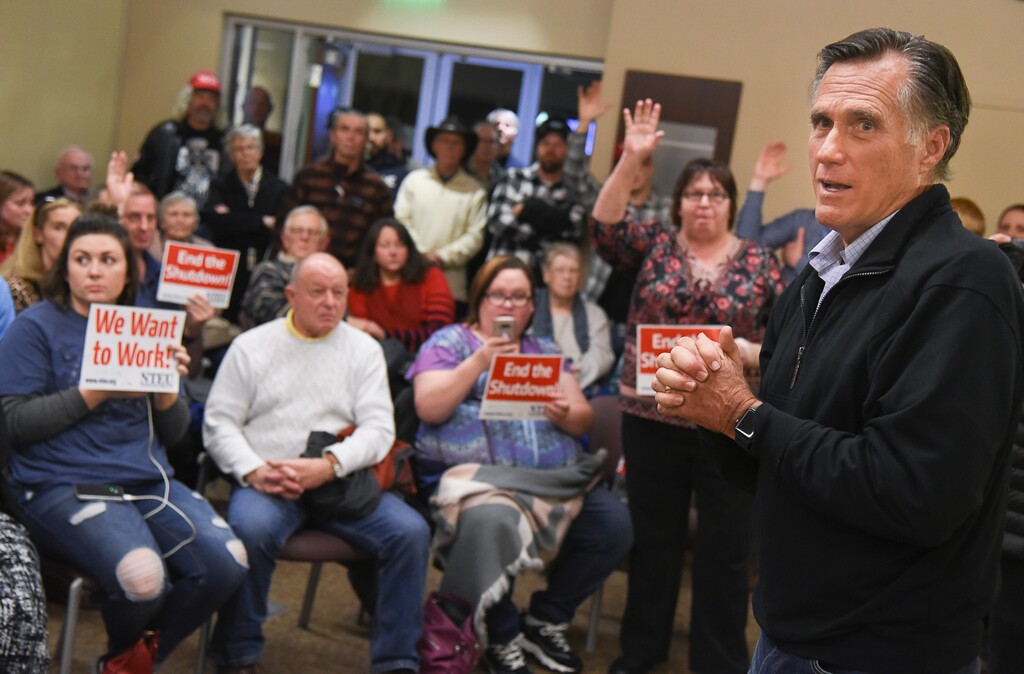 (Francisco Kjolseth  |  The Salt Lake Tribune)  U.S. Senator Mitt Romney visits some of the overflow rooms where people expressed their anger over the federal shutdown after holding a town hall meeting at the Davis County administration building, Tuesday, January 22, 2019, to hear from local residents.