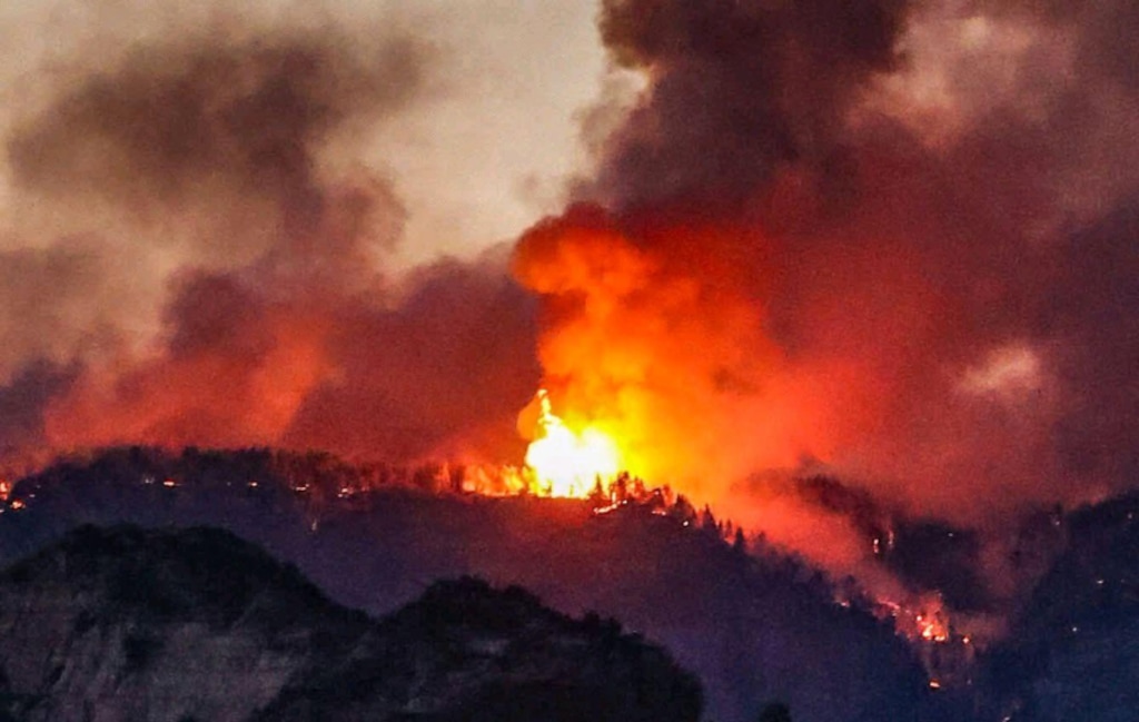 (Tamy Jaramillo/InciWeb) The Babylon Fire is seen from northwest of Blanding. The wildfire had grown to more than 96,500 acres and remained 0% contained Monday.