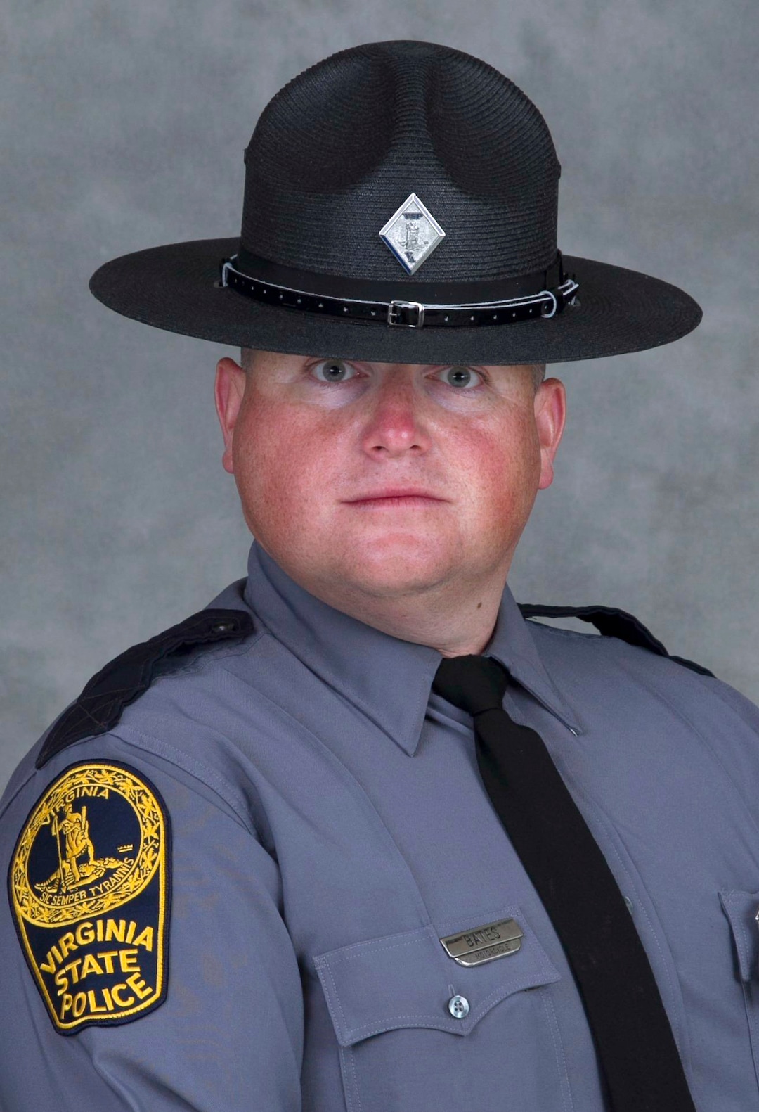This undated photo provided by the Virginia State Police shows Trooper-Pilot Berke M.M. Bates of Quinton, Va. Bates along with Lieutenant H. Jay Cullen were killed Saturday, Aug. 12, 2017, when the helicopter they were piloting crashed while assisting public safety resources during clashes at a nationalist rally in Charlottesville, Va. (Virginia State Police via AP)
