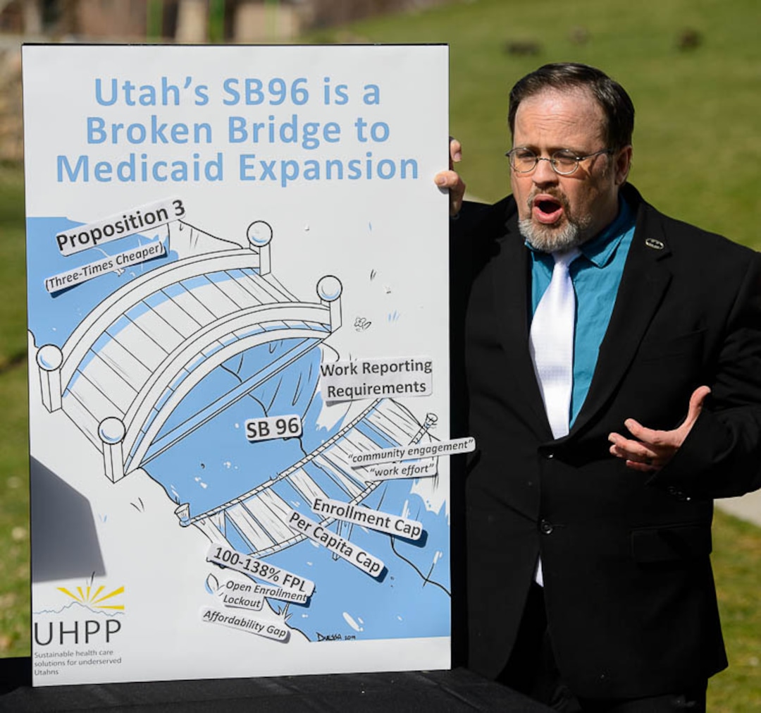 (Trent Nelson | The Salt Lake Tribune)  Paul Gibbs talks about Utah's "bridge" Medicaid expansion program at a news conference in Salt Lake City's Liberty Park on Monday April 1, 2019.