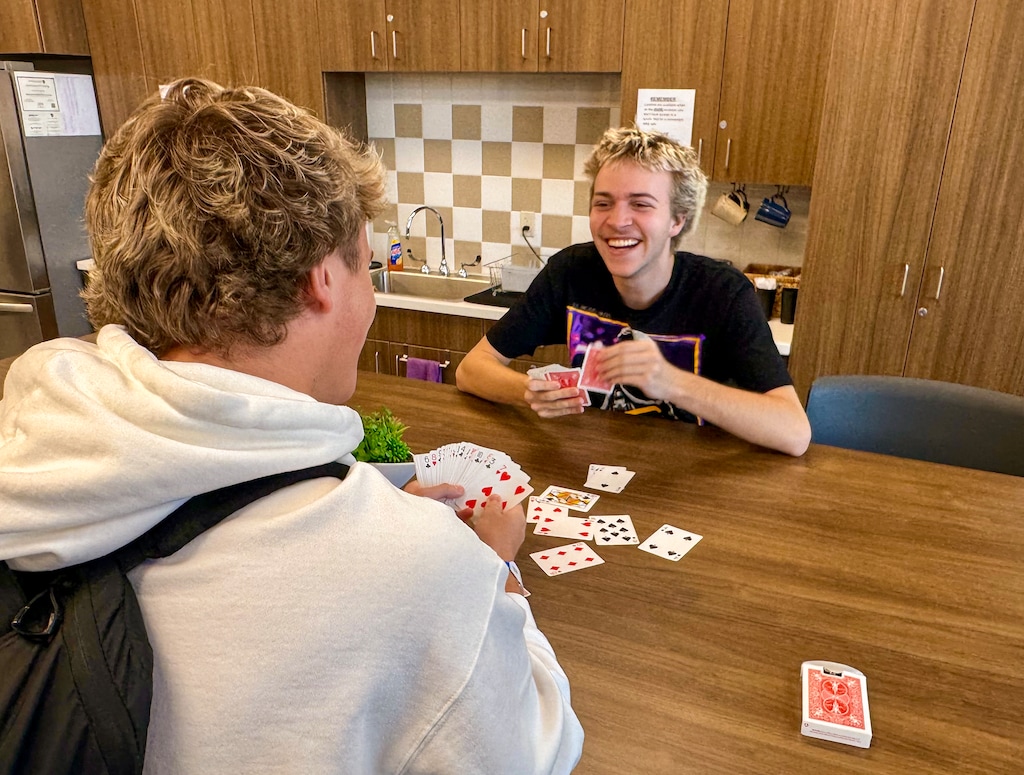 (Mark Eddington | The Salt Lake Tribune) Lincoln Neider, left, plays cards with classmate McKay Tebbs at Desert Hills High School's teen center in St. George, Monday Nov. 24, 2025. The centers are open to all students and offer meals, showers or simply a place to decompress and relax.