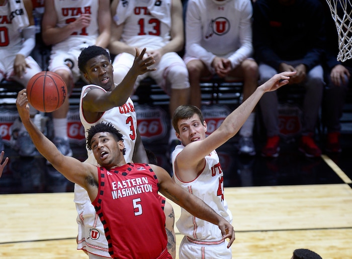 (Scott Sommerdorf   |  The Salt Lake Tribune)   Utah's Donnie Tillman, top, and Jakub Jokl battle for a rebound with Eastern Washington's Richard Polanco during second half play. Utah defeated Eastern Washington 85-69, Friday, November 24, 2017. 