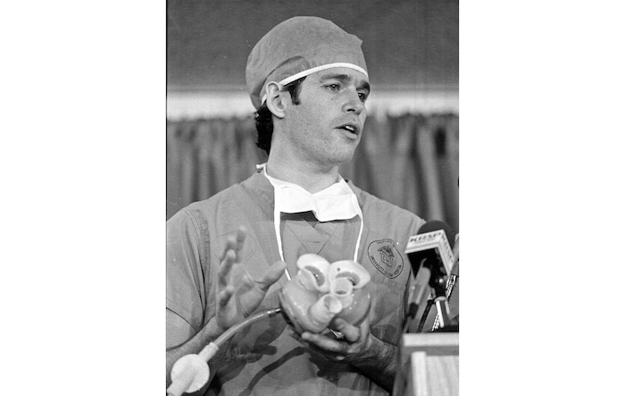 (Forrest Anderson |AP) Dr. Robert Jarvik, inventor of the artificial heart, Jarvik-7, holds up a model like the one implanted in Barney Clark in Salt Lake City, on Dec. 3, 1982. Jarvik died May 26, 2025, at age 79, at his home in Manhattan.