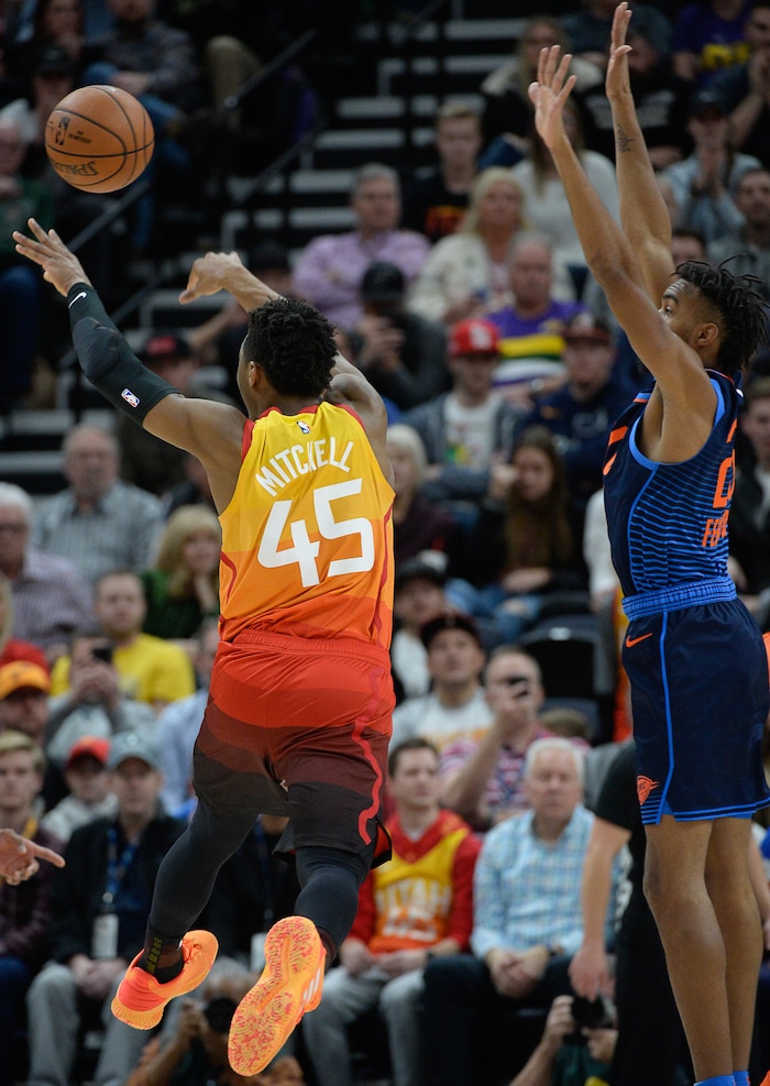 (Francisco Kjolseth  |  The Salt Lake Tribune)   Utah Jazz guard Donovan Mitchell (45) passes to an open teammate as they battle the Thunder in the second half of the NBA game at Vivint Smart Home Arena Sat., Dec. 22, 2018, in Salt Lake City.