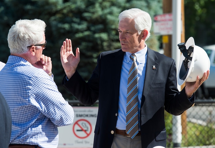 (Rick Egan  |  The Salt Lake Tribune)     Mark Isaac, Principal, Pinyon8 Consulting LLC chats with UTA’s Interim Executive Director Steve Meyer, after the ground breaking ceremony of UTA’s S-Line double track project, on 300 East and 2233 South, Monday, June 11, 2018.
