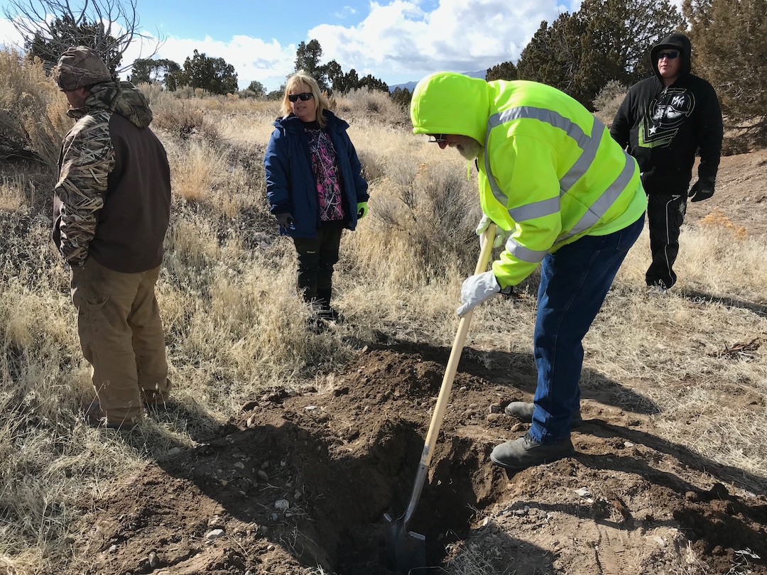 (Paighten Harkins | The Salt Lake Tribune) Bill Powell shovels out a recently dug hole while searching for Riley Powell and Breezy Otteson in the hills outside Eureka on Feb. 10, 2018. Footprints nearby led searchers to two mounds of disturbed dirt. They found nothing inside the holes.