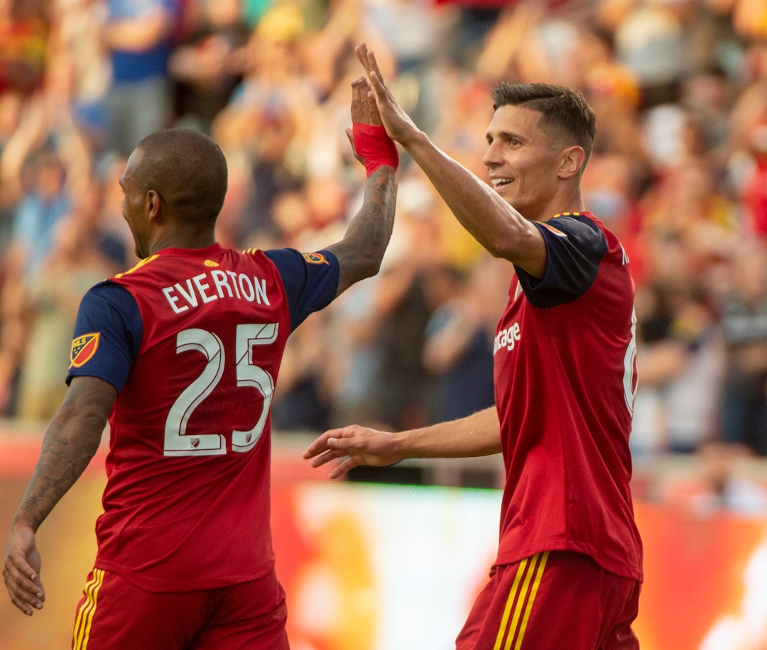 (Rick Egan  |  The Salt Lake Tribune)  Real Salt Lake midfielder Everton Luiz (25) congratulates Salt Lake midfielder Damir Kreilach (8) after the second goal for Salt Lake in MLS action  between Real Salt Lake and Sporting Kansas City, in Sandy, Saturday, June 29, 2019.