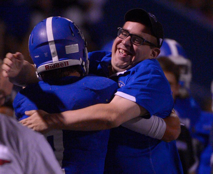 Leah Hogsten | The Salt Lake Tribune
Bingham's Brayden Cosper is bear-hugged on the sidelines after his two touchdowns in the final minutes of the game. Bishop Gorman defeated Bingham 38-20. Nationally No. 7-ranked Bingham High School hosted No. 1-ranked Bishop Gorman High School from Nevada, September 4, 2015.