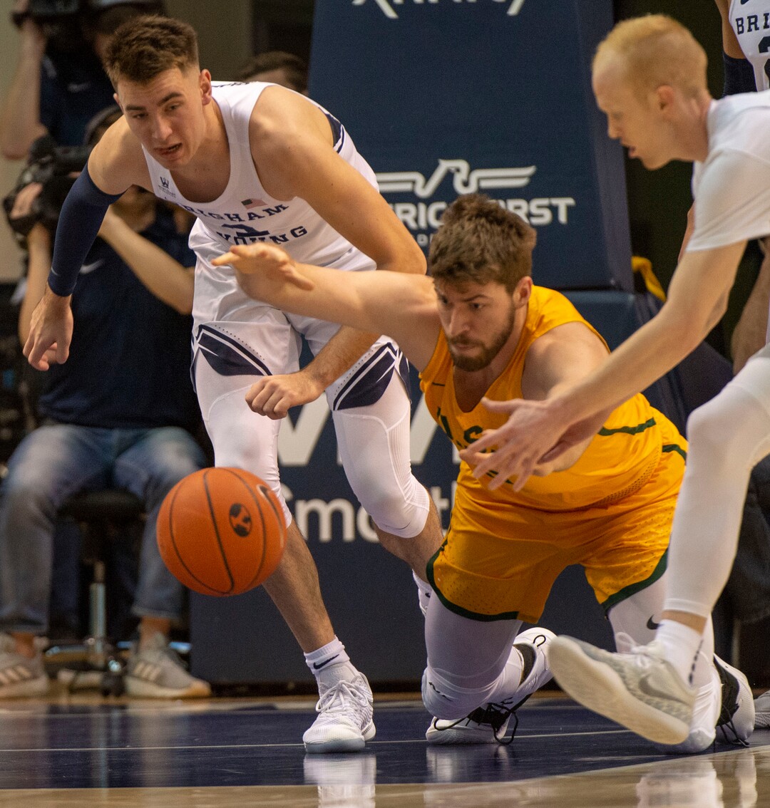 (Rick Egan  |  The Salt Lake Tribune)      Brigham Young Cougars guard Zac Seljaas (2) goes after a loose ball along with San Francisco Dons center Jimbo Lull (5), in WCC basketball action at the Marriott Center, Thursday, February 21, 2018.
