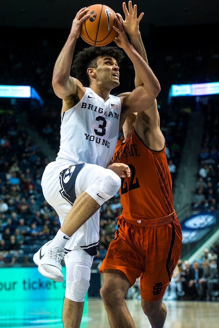 (Chris Detrick  |  The Salt Lake Tribune)  Brigham Young Cougars guard Elijah Bryant (3) shoots past Idaho State Bengals forward Jacob McCord (22) during the game at the Marriott Center Thursday, December 21, 2017.  