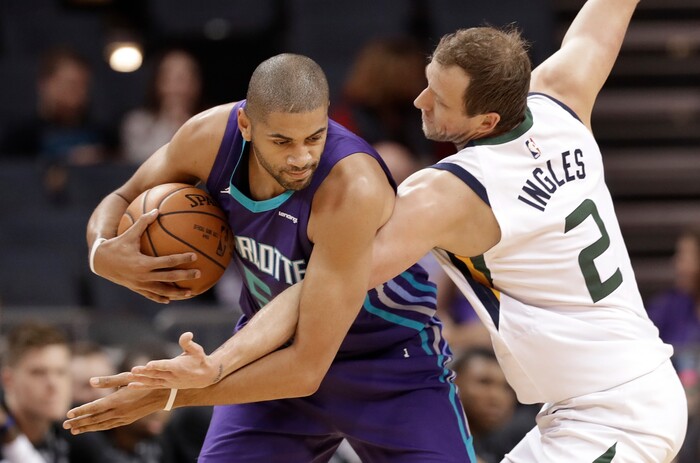 Utah Jazz's Joe Ingles (2) defends Charlotte Hornets' Nicolas Batum (5) during the first half of an NBA basketball game in Charlotte, N.C., Friday, Jan. 12, 2018. (AP Photo/Chuck Burton)