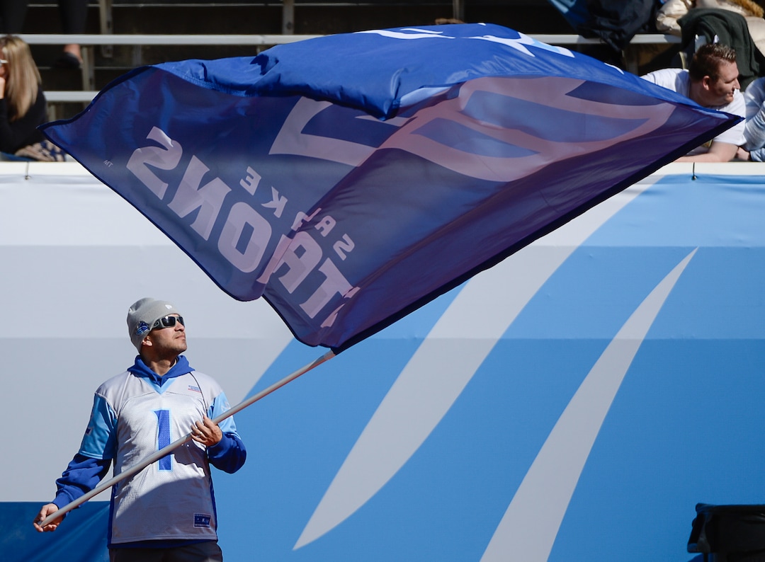 (Francisco Kjolseth  |  The Salt Lake Tribune)  Local Olympic speed skater Derek Parra stays incognito as hoists the Salt Lake Stallions game flag while the team hosts the Memphis Express of the Alliance of American Football in Salt Lake City on Saturday March 16, 2019.