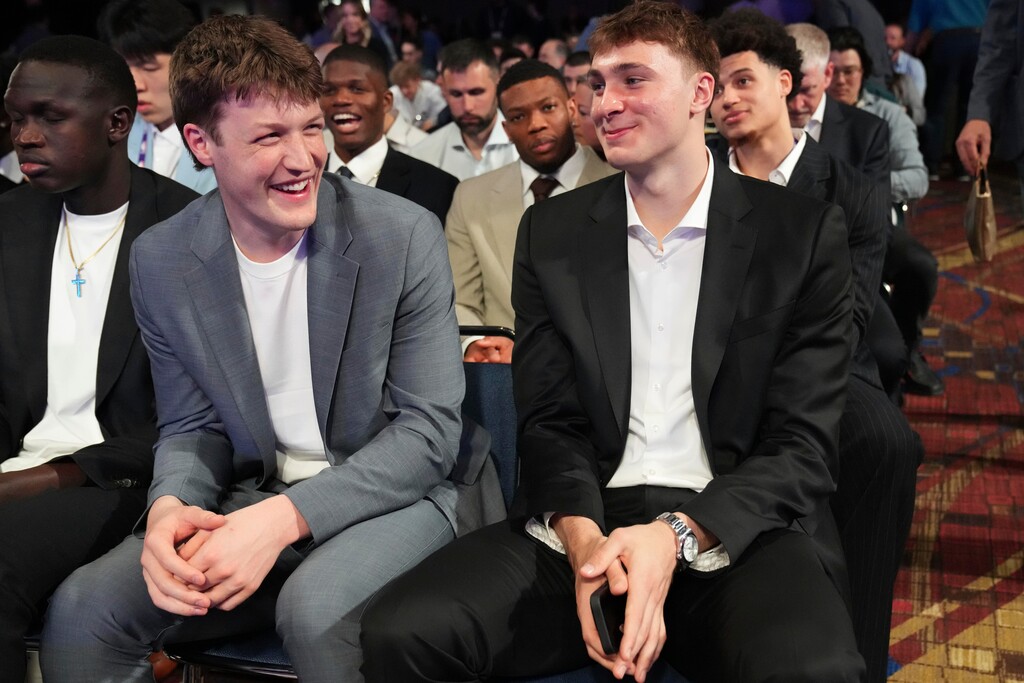 (Nam Y. Huh | AP) Duke's Kon Knueppel, left, and Cooper Flagg, right, smile at the NBA basketball draft lottery in Chicago, Monday, May 12, 2025.