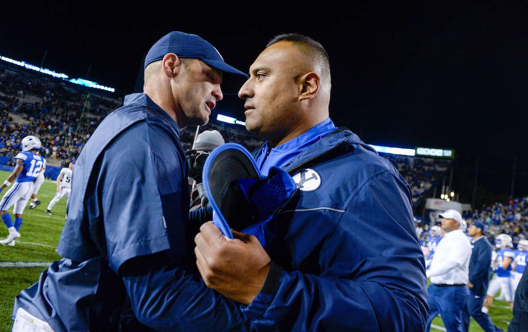 Leah Hogsten  |  The Salt Lake Tribune   Utah State Aggies head coach Matt Wells and Brigham Young Cougars head coach Kalani Sitake shake hands after the game. Utah State University defeated BYU, 45-20, at Lavell Edwards Stadium in Provo, Friday, Oct. 5, 2018.